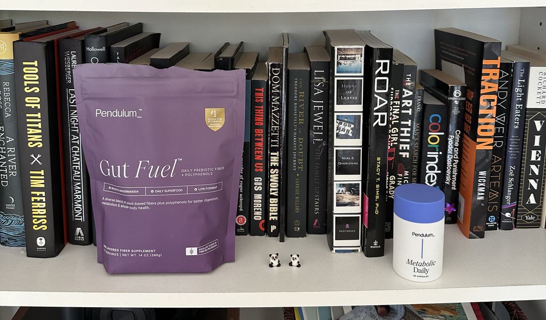 Bookshelf in Joanna’s office with Pendulum Gut Fuel and Metabolic Daily on the shelf